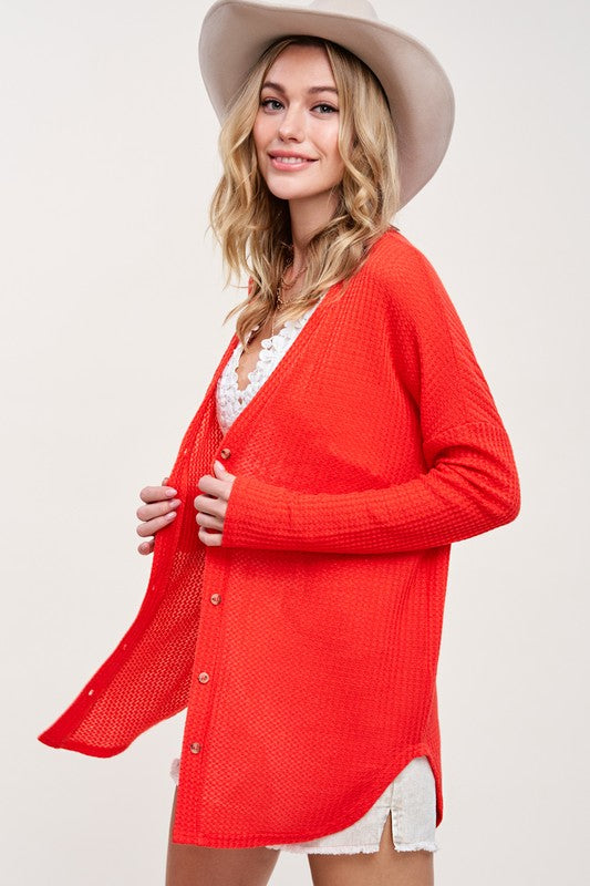 Greta CardiganWrap yourself in comfort and style with this casual cardigan made from soft and stretchy waffle fabric. It's perfect for layering or wearing on its own, making it a 