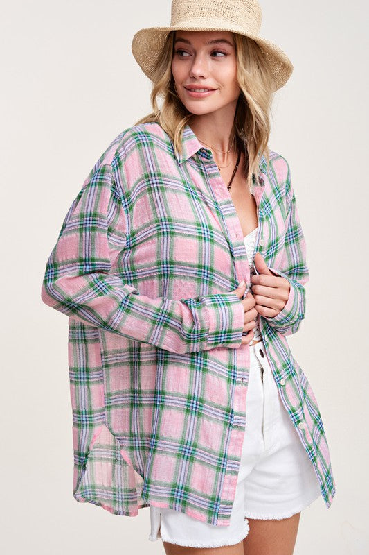 Liz ShirtA bold and stylish button-down shirt that effortlessly blends fashion and comfort. This shirt features a striking plaid print and is designed with a relaxed fit, mak