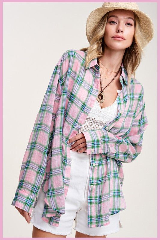 Liz ShirtA bold and stylish button-down shirt that effortlessly blends fashion and comfort. This shirt features a striking plaid print and is designed with a relaxed fit, mak