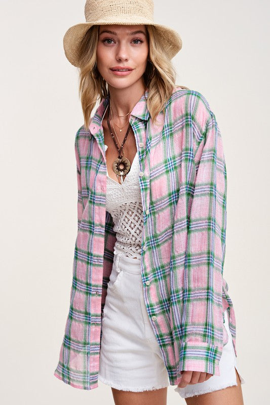 Liz ShirtA bold and stylish button-down shirt that effortlessly blends fashion and comfort. This shirt features a striking plaid print and is designed with a relaxed fit, mak