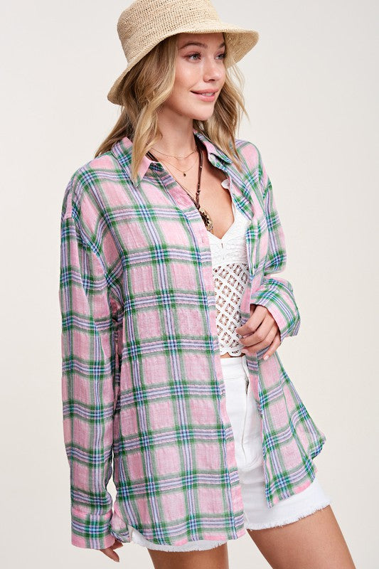 Liz ShirtA bold and stylish button-down shirt that effortlessly blends fashion and comfort. This shirt features a striking plaid print and is designed with a relaxed fit, mak