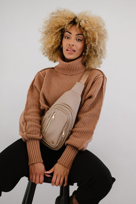 Camry Sling CrossbodyThe Camry Sling Crossbody. This silky-soft vegan leather bag fits everything you need while you're on the go, without being bulky. The front pocket zips for easy pho