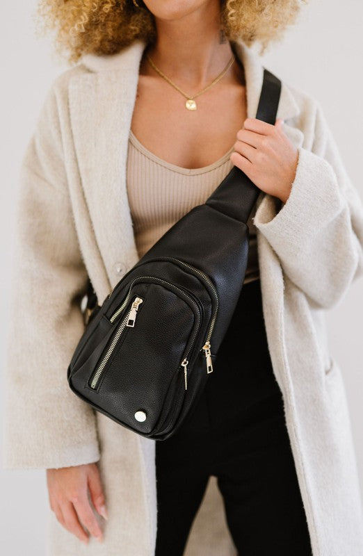 Camry Sling CrossbodyThe Camry Sling Crossbody. This silky-soft vegan leather bag fits everything you need while you're on the go, without being bulky. The front pocket zips for easy pho