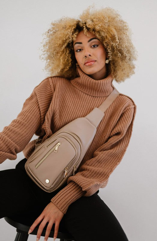 Camry Sling CrossbodyThe Camry Sling Crossbody. This silky-soft vegan leather bag fits everything you need while you're on the go, without being bulky. The front pocket zips for easy pho