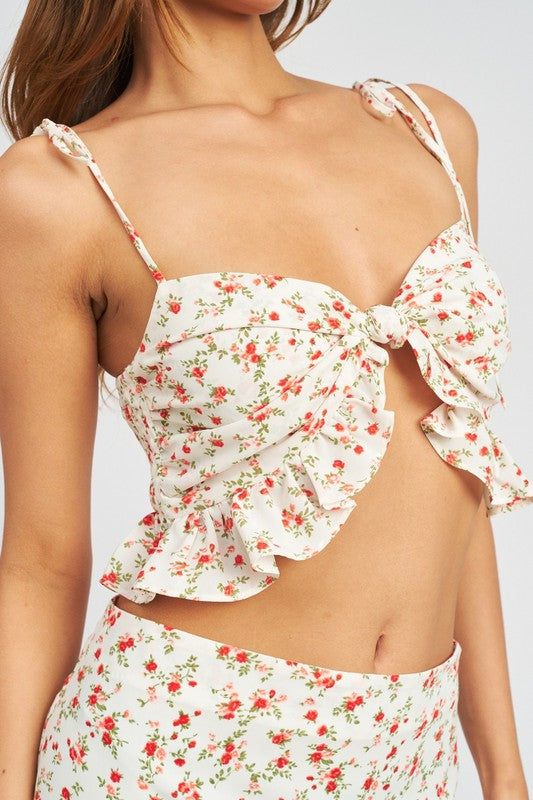 FRONT KNOT CROP TOP WITH RUFFLE DETAILSIZE &amp; FIT :MODEL WEARS SIZE SMALLMODEL'S HEIGHT 5'9Made In: IMPORTEDFabric Contents: 100% POLYESTERLINING: 100% POLYESTER