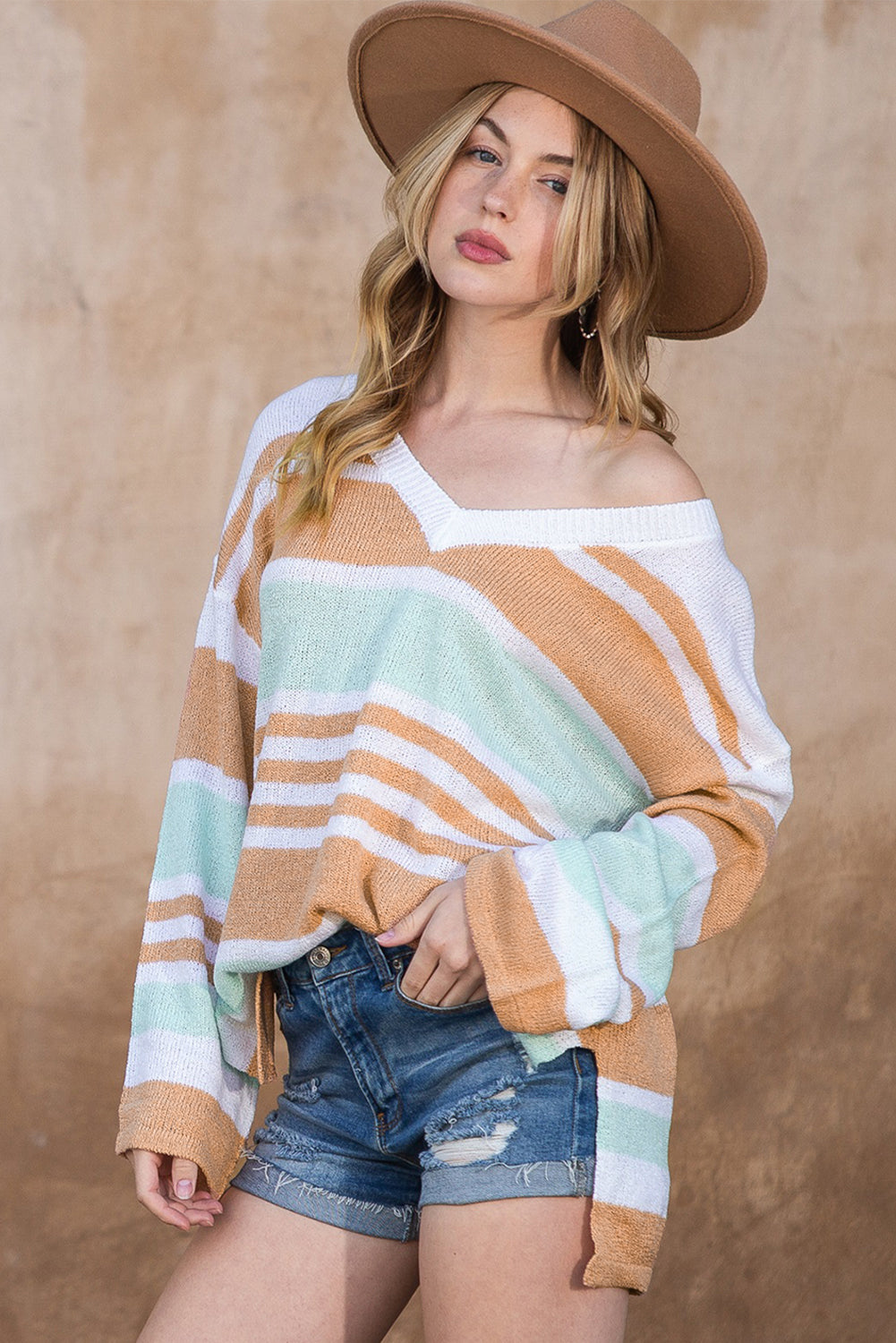 Multicolor Colorblock Stripe V Neck Split SweaterMaterial:100%Acrylic


	


		The V-neckline and split hem add a touch of elegance, while the colorblock design adds a modern and trendy twist.
	
	
		Add a pop