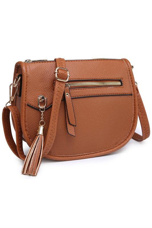 Fashion Saddle Crossbody BagFashion Saddle Crossbody Bag Faux vegan leather Zip top closure Gold-tone hardware Adjustable shoulder strap L 8 * H 6.5 * W 3