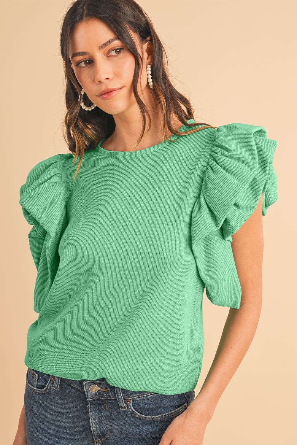 Green Solid Color Ruffle Sleeve Ribbed BlouseMaterial:65%cotton+33%polyester+2%Elastane



		The blouse features ruffle sleeves, which add a playful and romantic touch to the overall design. 
	
	
		The sol