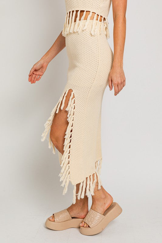 Tassel Detail Sweater Midi SkirtIntroducing our Tassel Detail Sweater Midi Skirt, a chic and versatile piece for your wardrobe. This midi skirt features stylish tassel details along the hem, adding