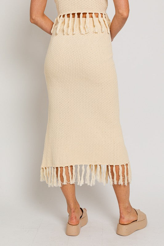 Tassel Detail Sweater Midi SkirtIntroducing our Tassel Detail Sweater Midi Skirt, a chic and versatile piece for your wardrobe. This midi skirt features stylish tassel details along the hem, adding