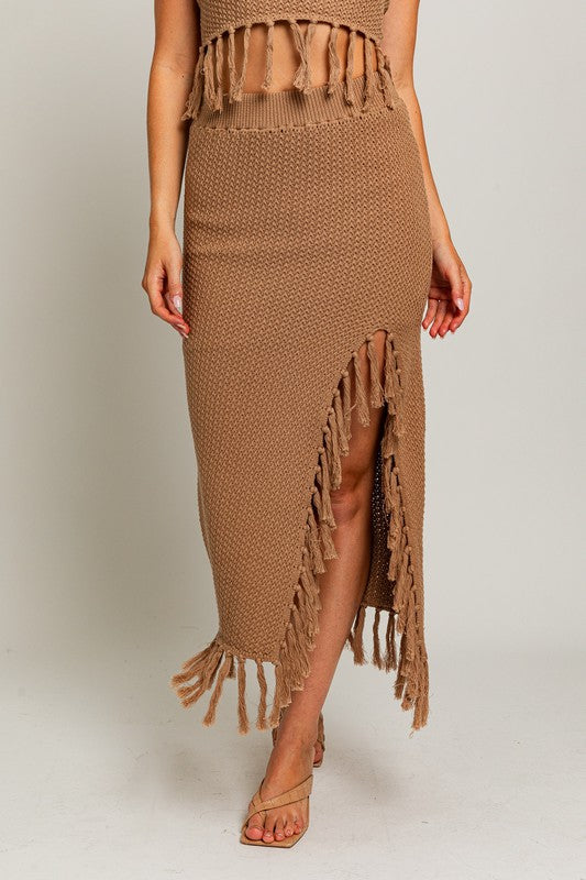 Tassel Detail Sweater Midi SkirtIntroducing our Tassel Detail Sweater Midi Skirt, a chic and versatile piece for your wardrobe. This midi skirt features stylish tassel details along the hem, adding