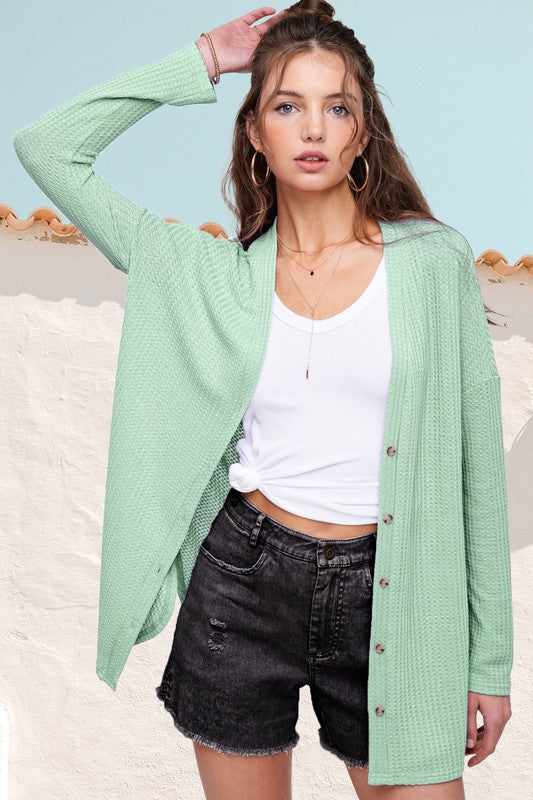 Greta CardiganWrap yourself in comfort and style with this casual cardigan made from soft and stretchy waffle fabric. It's perfect for layering or wearing on its own, making it a 