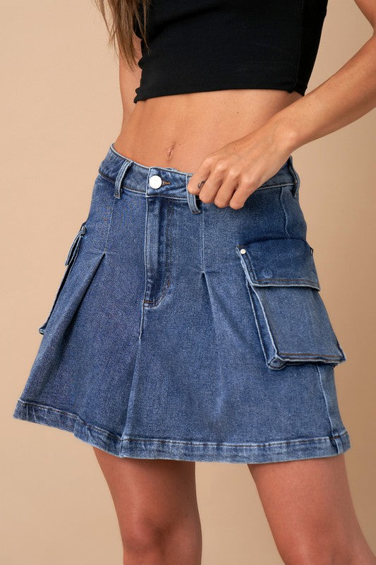 PLEATED CARGO DENIM MINI SKIRTPLEATED CARGO DENIM MINI SKIRT51%Cotton, 43%Rayon, 5%Polyester, 1%SpandexModel is wearing size 3/25, Height 5'8Waist - 26 1/2Hip - 35Front Length - 15Bottom Sweep - 