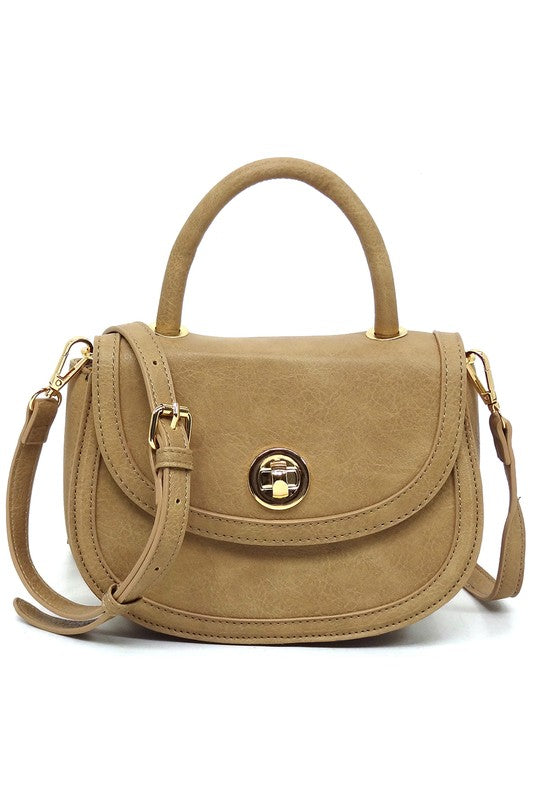 Fashion Flap Saddle SatchelUpgrade your style game with our Fashion Flap Saddle Satchel. This chic accessory features a trendy flap design, adding a touch of sophistication to your ensemble. T