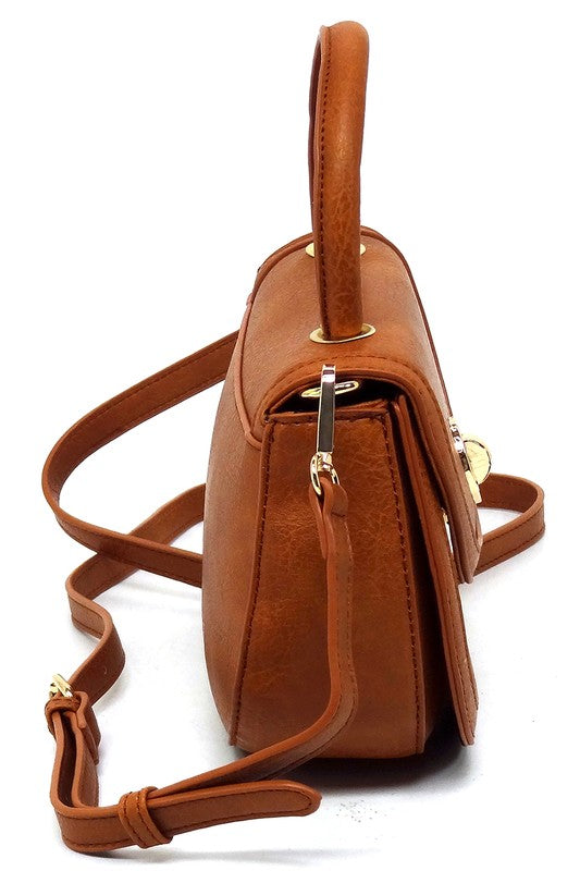 Fashion Flap Saddle SatchelUpgrade your style game with our Fashion Flap Saddle Satchel. This chic accessory features a trendy flap design, adding a touch of sophistication to your ensemble. T