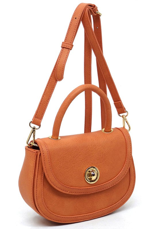 Fashion Flap Saddle SatchelUpgrade your style game with our Fashion Flap Saddle Satchel. This chic accessory features a trendy flap design, adding a touch of sophistication to your ensemble. T