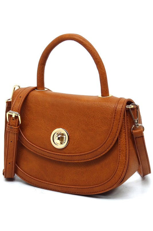 Fashion Flap Saddle SatchelUpgrade your style game with our Fashion Flap Saddle Satchel. This chic accessory features a trendy flap design, adding a touch of sophistication to your ensemble. T