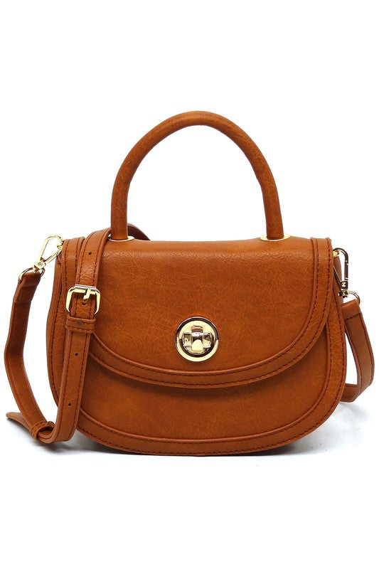 Fashion Flap Saddle SatchelUpgrade your style game with our Fashion Flap Saddle Satchel. This chic accessory features a trendy flap design, adding a touch of sophistication to your ensemble. T