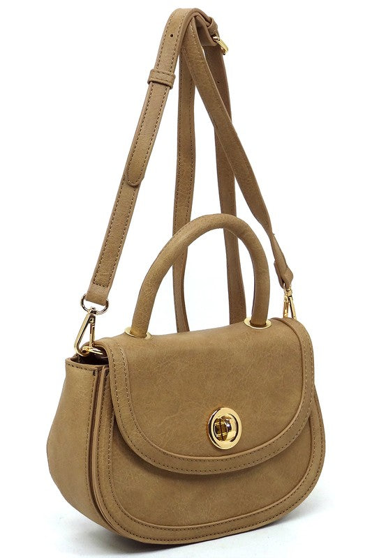 Fashion Flap Saddle SatchelUpgrade your style game with our Fashion Flap Saddle Satchel. This chic accessory features a trendy flap design, adding a touch of sophistication to your ensemble. T