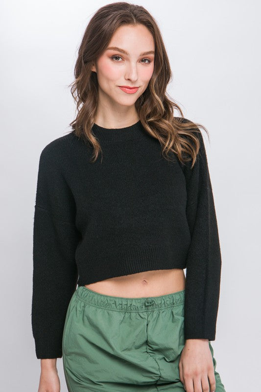 Wool Blend Cropped Sweater TopElevate your winter wardrobe with our Wool Blend Cropped Sweater Top, a perfect blend of comfort and style. Crafted from a cozy wool blend, this sweater top offers a