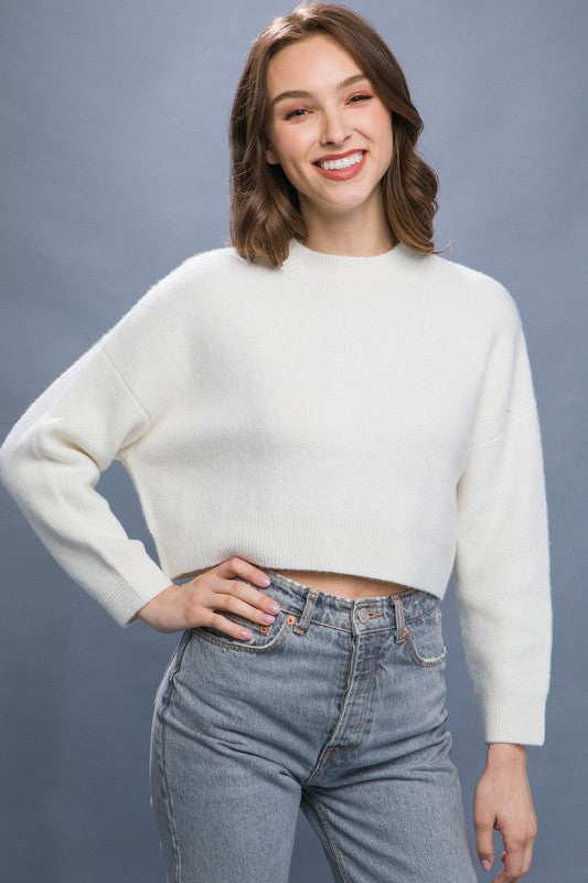 Wool Blend Cropped Sweater TopElevate your winter wardrobe with our Wool Blend Cropped Sweater Top, a perfect blend of comfort and style. Crafted from a cozy wool blend, this sweater top offers a