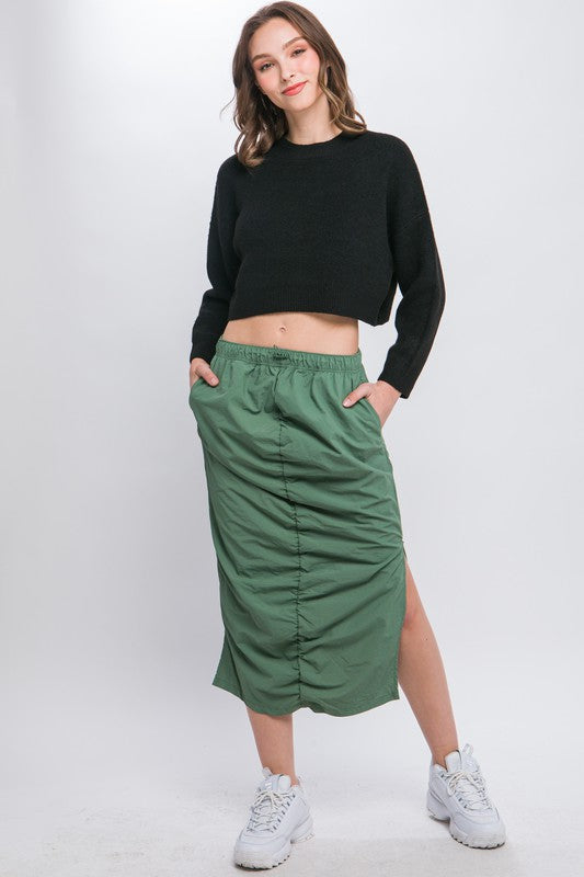 Wool Blend Cropped Sweater TopElevate your winter wardrobe with our Wool Blend Cropped Sweater Top, a perfect blend of comfort and style. Crafted from a cozy wool blend, this sweater top offers a