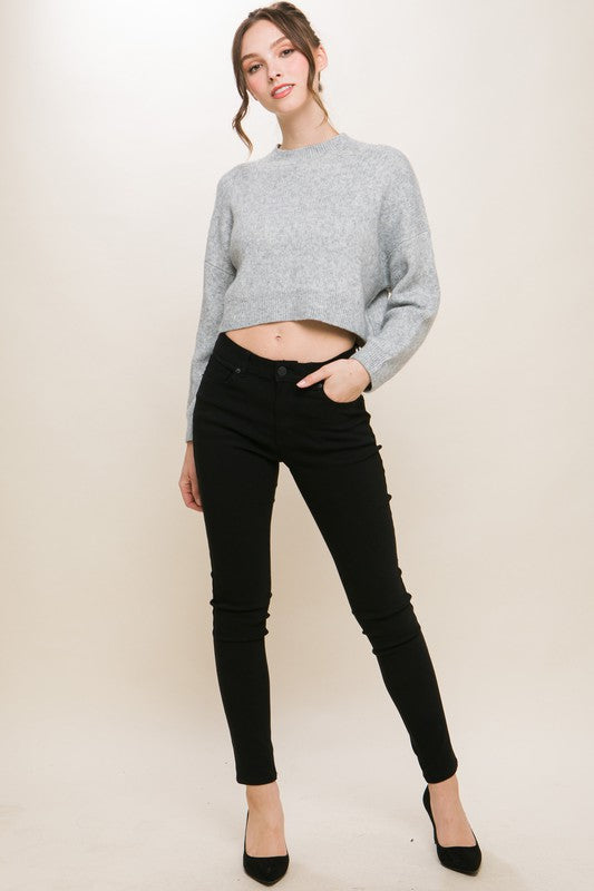 Wool Blend Cropped Sweater TopElevate your winter wardrobe with our Wool Blend Cropped Sweater Top, a perfect blend of comfort and style. Crafted from a cozy wool blend, this sweater top offers a