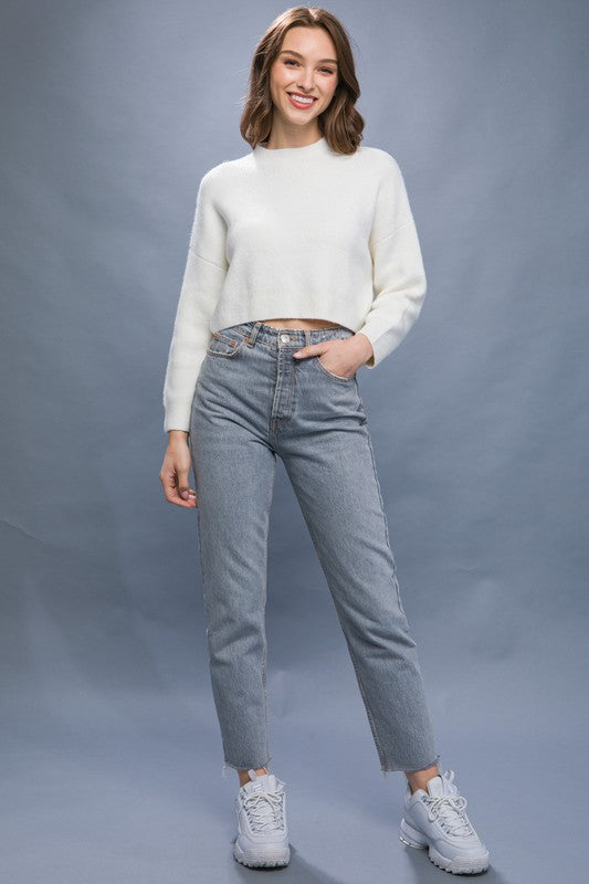 Wool Blend Cropped Sweater TopElevate your winter wardrobe with our Wool Blend Cropped Sweater Top, a perfect blend of comfort and style. Crafted from a cozy wool blend, this sweater top offers a