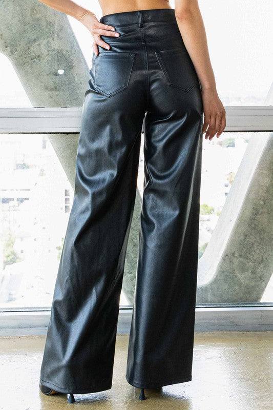 Vegan Leather Wide Leg PantsIndulge in cruelty-free chic with our Vegan Leather Wide Leg Pants. Crafted from high-quality PU, these pants showcase a modern edge with two front and back pockets,