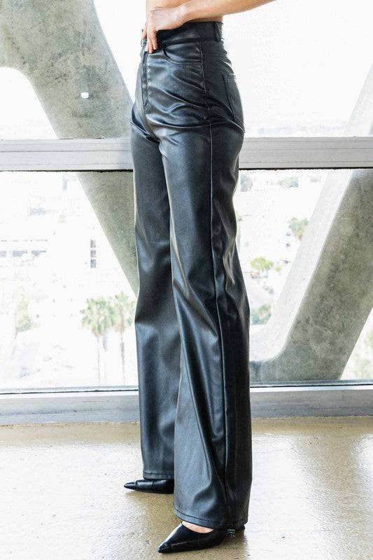 Vegan Leather Wide Leg PantsIndulge in cruelty-free chic with our Vegan Leather Wide Leg Pants. Crafted from high-quality PU, these pants showcase a modern edge with two front and back pockets,