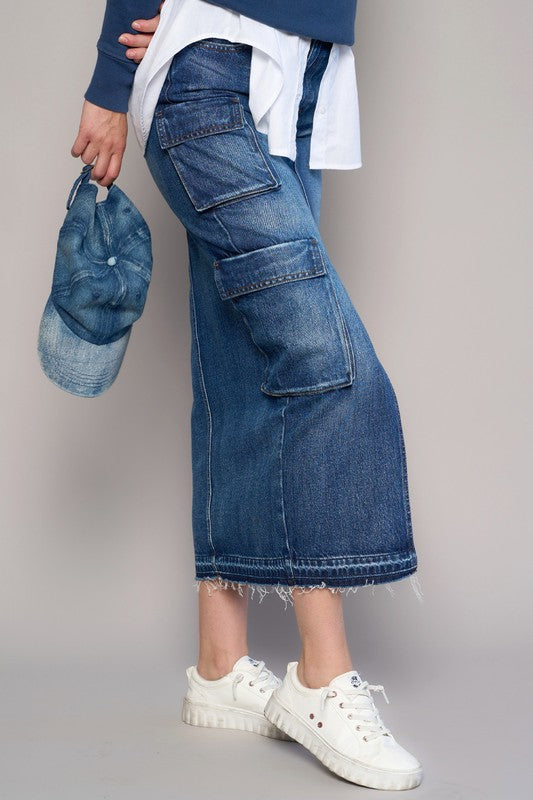 CARGO POCKET LONG SKIRT- 100% Cotton- Non-Stretch Denim- Cargo Pocket Long Skirt- Front Slit Detail- Front Zipper Fly - 8 pocketsThe model is wearing size 3/25, Height 5'8Waist - 28Hip - 3