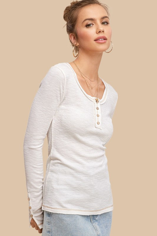 Leah TopA great wardrobe starts with solid basics, just like our Leah Top! This super soft jersey knit top has a classic button-down crew neckline, long sleeves- we added so