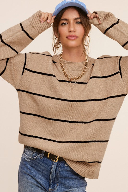 Eunice SweaterIntroducing the Eunice Sweater, a timeless striped pullover that embodies a loose and comfortable fit. This versatile piece is destined to become your go-to option, 