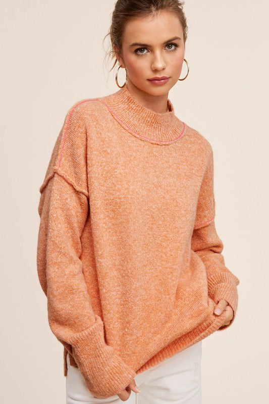 Ella SweaterThe knit sweater embraces both coziness and fashion with its tactile allure and versatile charm. The sweater provides warmth without compromising on style, featuring