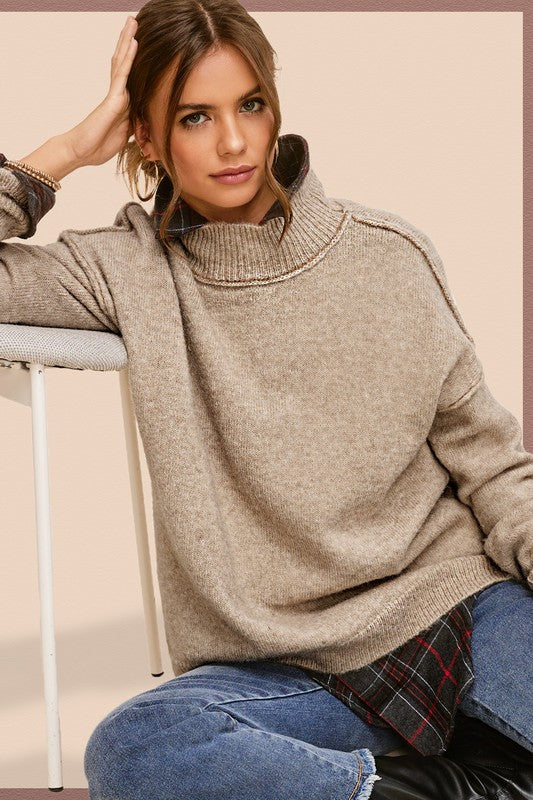 Ella SweaterThe knit sweater embraces both coziness and fashion with its tactile allure and versatile charm. The sweater provides warmth without compromising on style, featuring