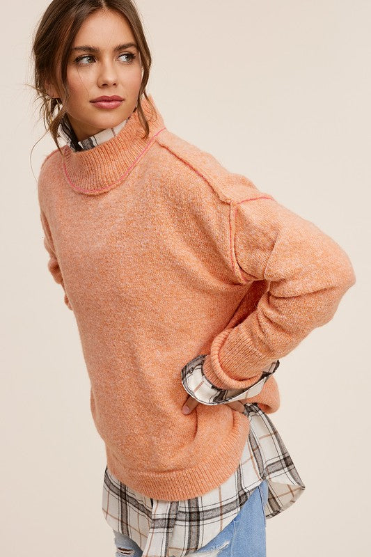 Ella SweaterThe knit sweater embraces both coziness and fashion with its tactile allure and versatile charm. The sweater provides warmth without compromising on style, featuring