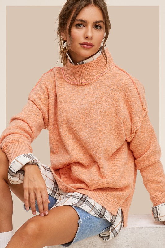 Ella SweaterThe knit sweater embraces both coziness and fashion with its tactile allure and versatile charm. The sweater provides warmth without compromising on style, featuring