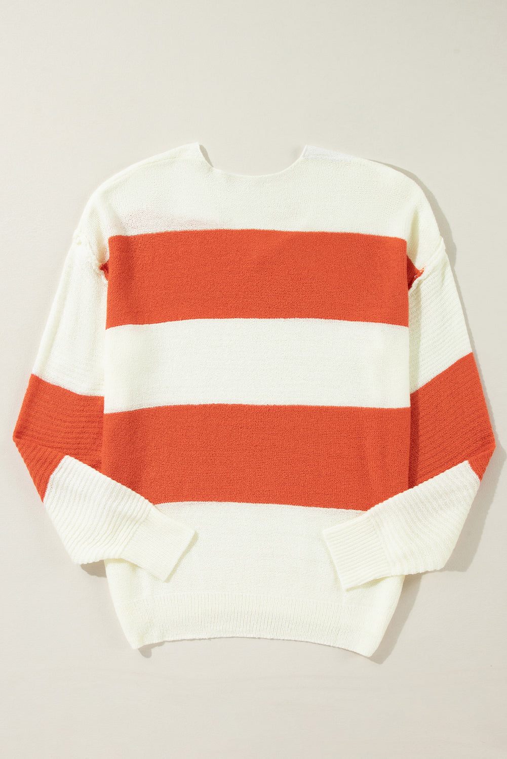 Orange Colorblock V Neck Side Slits SweaterMaterial:100%Acrylic

• Stand out in style with our sweater, blending casual stripes with a trendy rib-knit design.
• The vibrant orange hues add a pop of color to