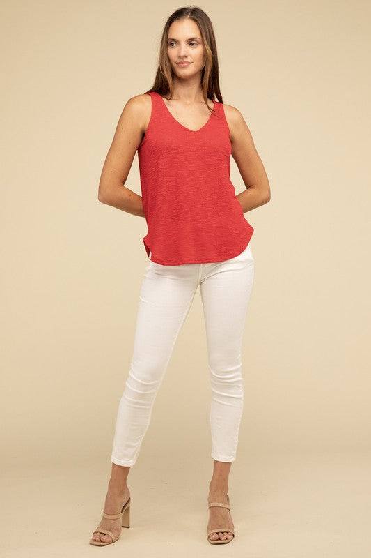 V Neck Sleeveless Cami TopThe V Neck Sleeveless Cami Top is a chic and versatile addition to any wardrobe. Featuring a flattering V neckline and a sleeveless design, this cami top is perfect 