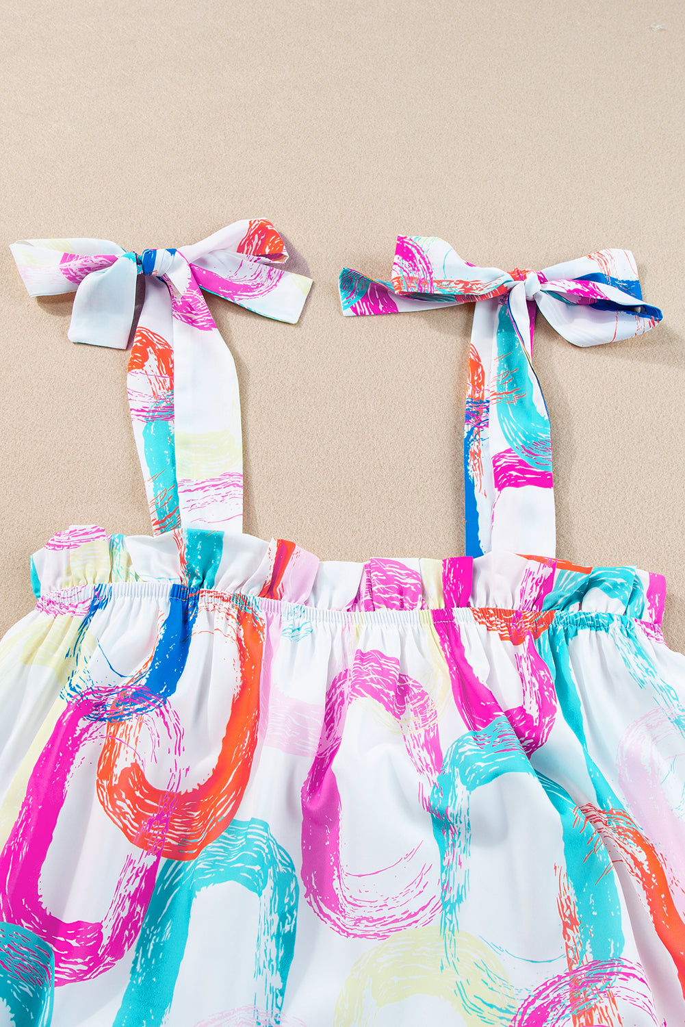 White Abstract Print Knot Straps Frill Mini DressMaterial:100%Polyester

• Embrace a blend of elegance and playfulness with our mini dress, perfect for any summer occasion.
• The intricate abstract print adds a t