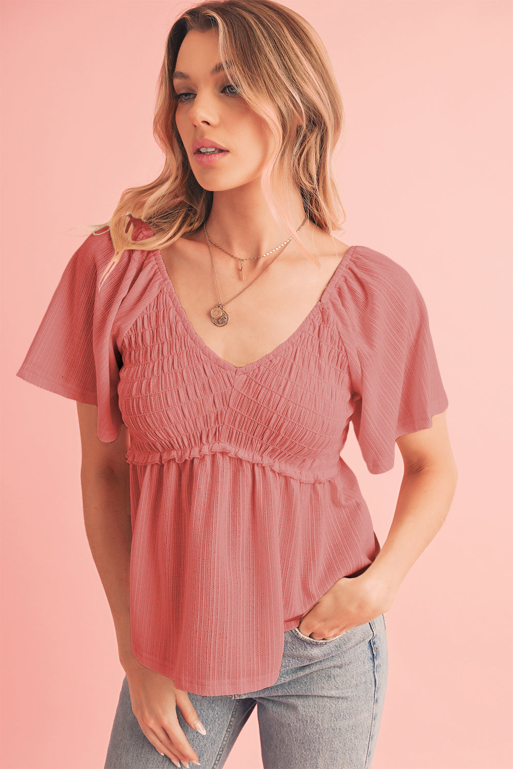 Tomato Red Shirred V Neck Short Flutter Sleeve Textured BlouseMaterial:95%POLYESTER+5%ELASTANE



		The blouse is a charming and feminine top featuring a shirred V-neckline and delicate flutter sleeves, adding a touch of eleg