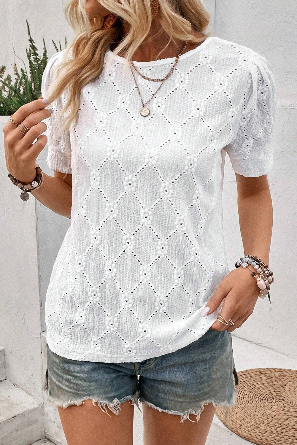 White Eyelet Embroidered Short Puff Sleeve BlouseMaterial:95%Polyester+5%Elastane

• This blouse exudes elegance with its delicate eyelet embroidery, adding a touch of sophistication to any outfit.
• The plain wh