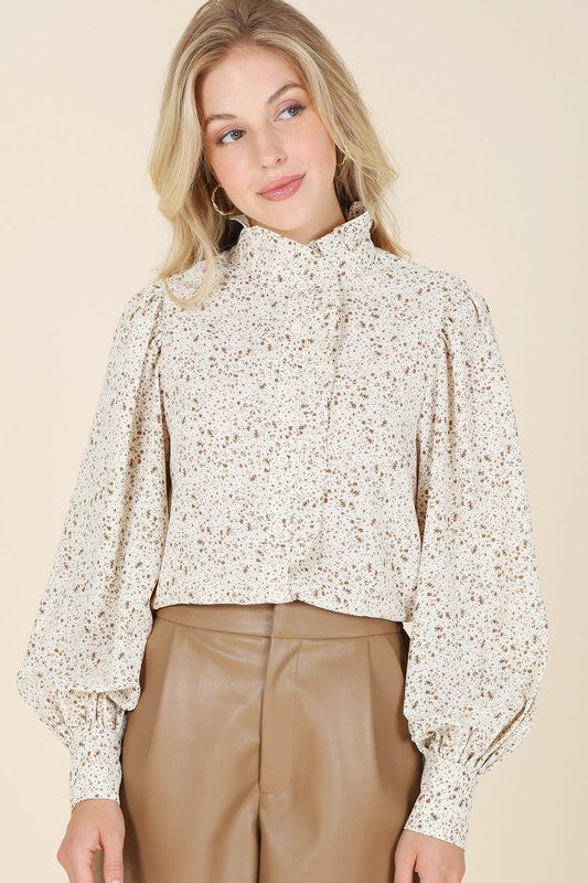 Stand collar floral frill blouse- Stand collar floral frill blouse, shirring at stand collar, shoulder and cuff, ruffle at center front until half up, 7 buttons at center front opening and 3 button