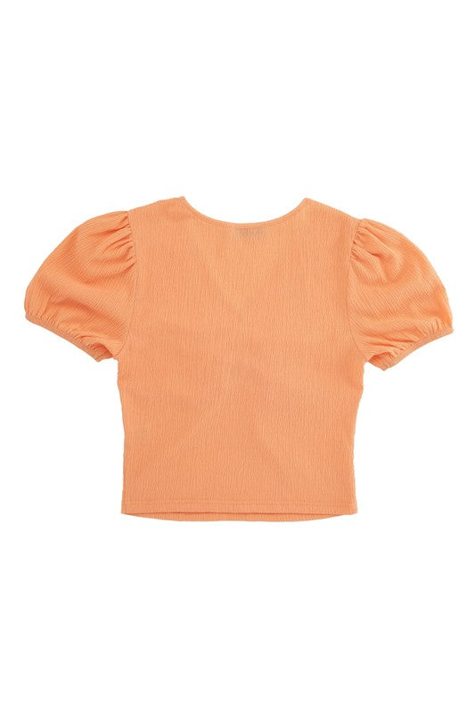 Shirred V neck top with puff sleeves- Shirred V neck top with puff sleeves- Pattern type : solid- Neck line : V neck- Sleeve type : puff sleeves- Sleeve length : short sleeves- Stretch : stretch- Sheer