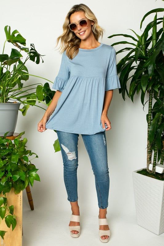 PLUS SOLID RUFFLE SLEEVE LOOSE TOPSOLID JERSEY ROUND NECK HALF RUFFLE SLEEVE LOOSE FIT PLUS TOP95% RAYON, 5% SPANDEX MADE IN USA1X/2X/3X 2-2-2
Style: Casual
Print / Pattern: SOLID
Fit: LOOSE FIT 
Nec