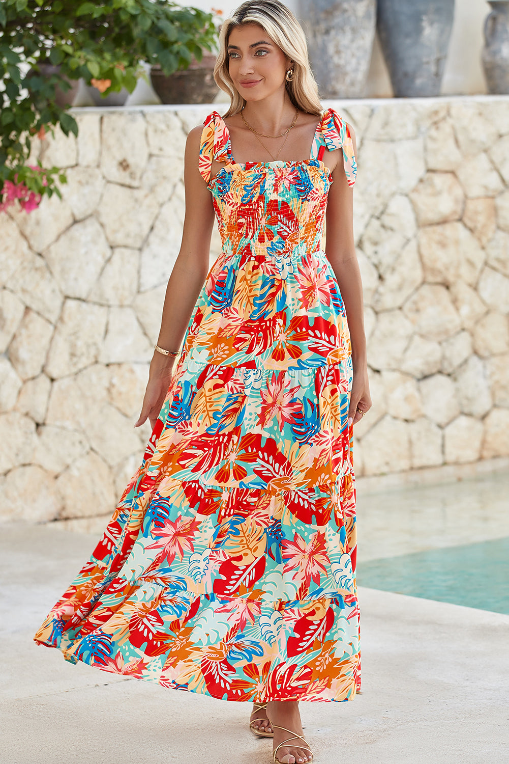 Multicolor Boho Tropical Print Smocked Ruffle Tiered Maxi DressMaterial:100%Polyester



		•The tiered design of the dress adds volume, creating a flowy and feminine look.
	
	
		•Smocked bodice and tie shoulder straps give 