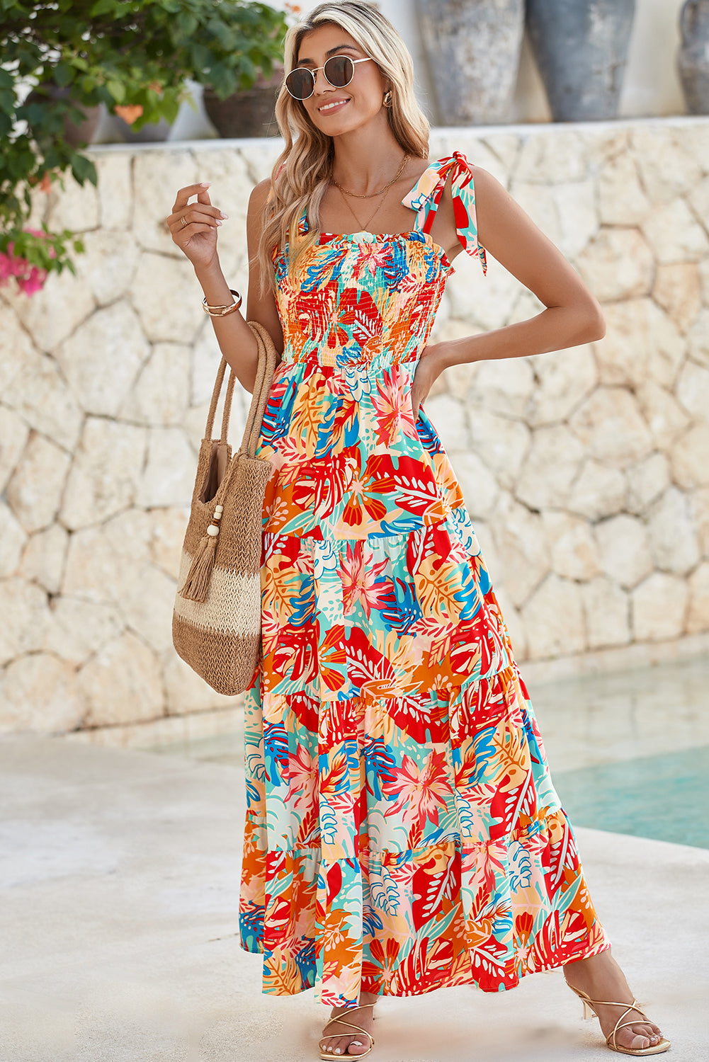 Multicolor Boho Tropical Print Smocked Ruffle Tiered Maxi DressMaterial:100%Polyester



		•The tiered design of the dress adds volume, creating a flowy and feminine look.
	
	
		•Smocked bodice and tie shoulder straps give 