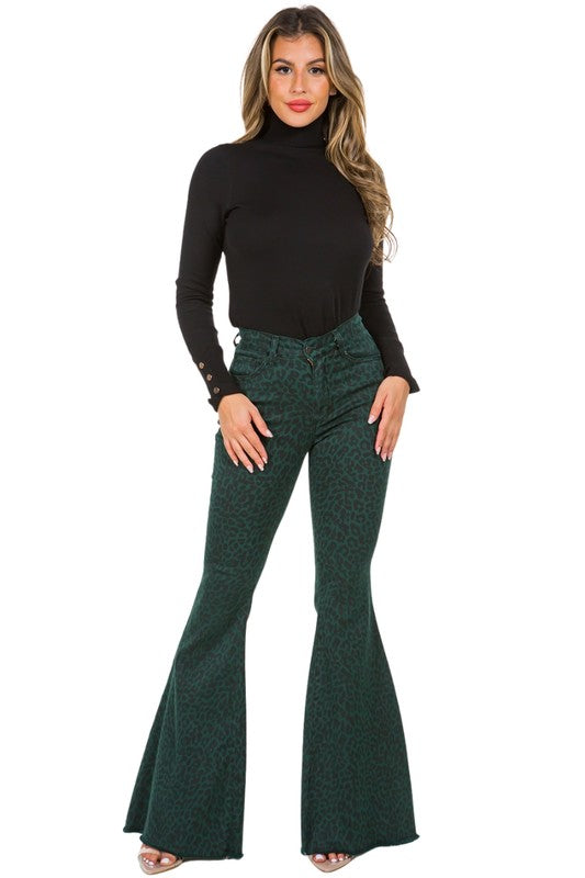 Leopard Bell Bottom Jean in Pine GreenFull Length 5 pocket bell bottom jean features frayed hem, Front and back pockets, Pine green Denim leopard Print,34" inseam, 10.5" Rise, Stretch Denim, Made in USA
