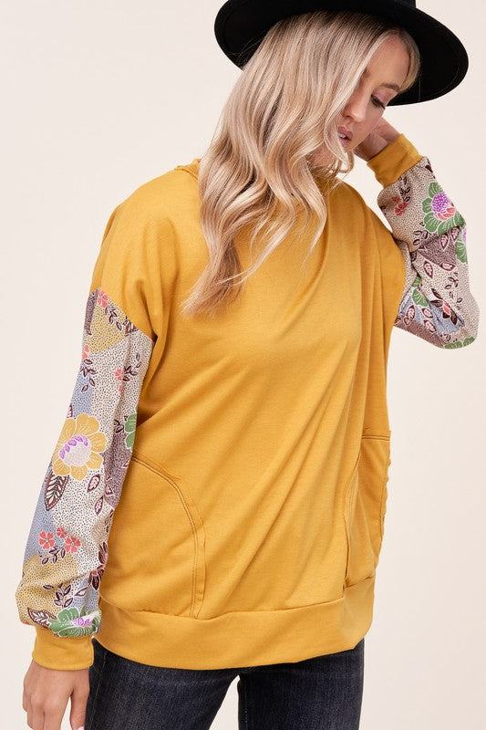 WOVEN FLORAL MIXED TOPFRENCH TERRY SOLID AND WOVEN FLORAL PRINT MIXED LONG SLEEVE SIDE POCKET RAW EDGE DETAIL TOP - MADE IN U.S.A.
Style: Casual
Print / Pattern: SOLID AND WOVEN FLORAL 
F