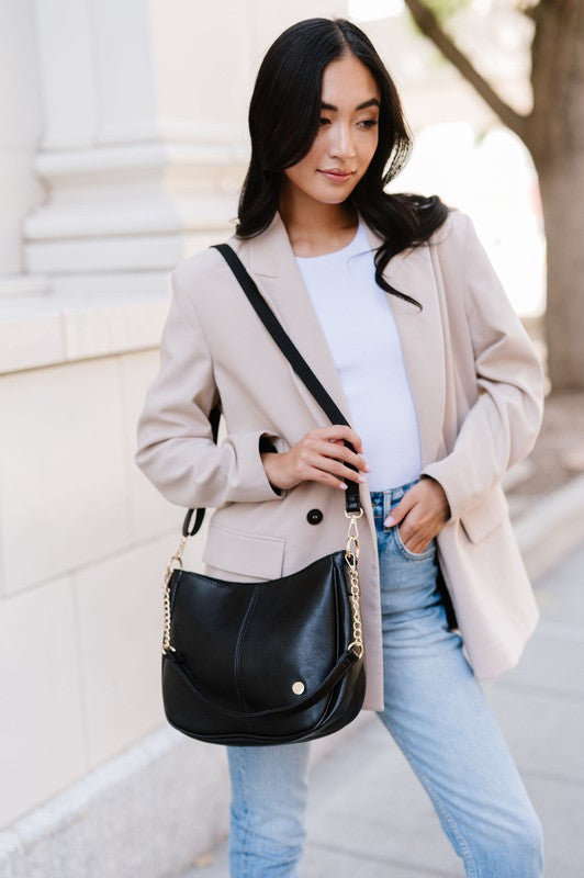 MARISA CROSSBODY SLING PURSE HANDBAGMade from buttery-soft vegan leather and glossy gold hardware, the Marissa Crossbody is the epitome of quiet luxury. This stunning saddle bag transforms seamlessly f